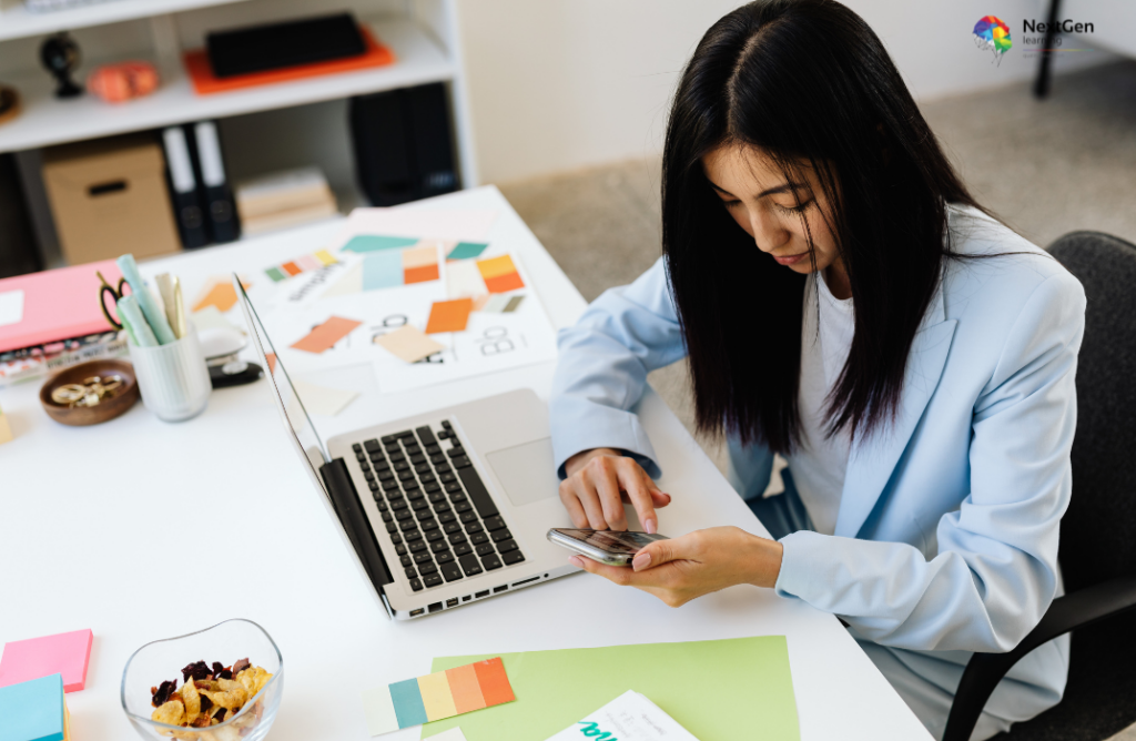 Designer Working with Laptop and Phone