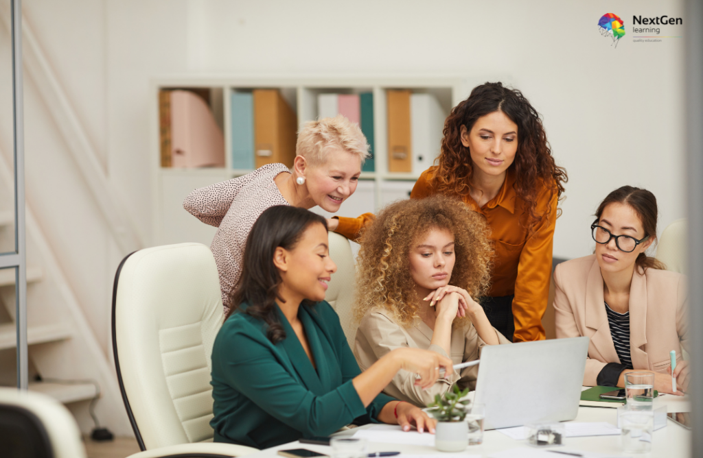 Group Discussion Around Laptop in Office