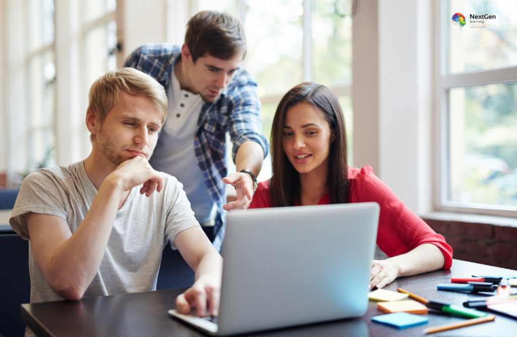 Group Discussing Project Around Laptop