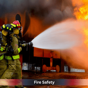 Firefighters extinguishing a large industrial fire, highlighting emergency response and workplace fire safety training.