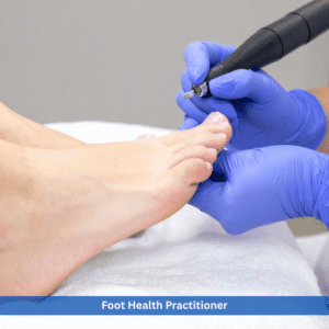 Foot Health Practitioner performing professional toenail care treatment using electric podiatry tool on patient foot in clinical setting