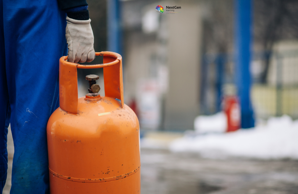 Worker Holding Orange LPG Cylinder