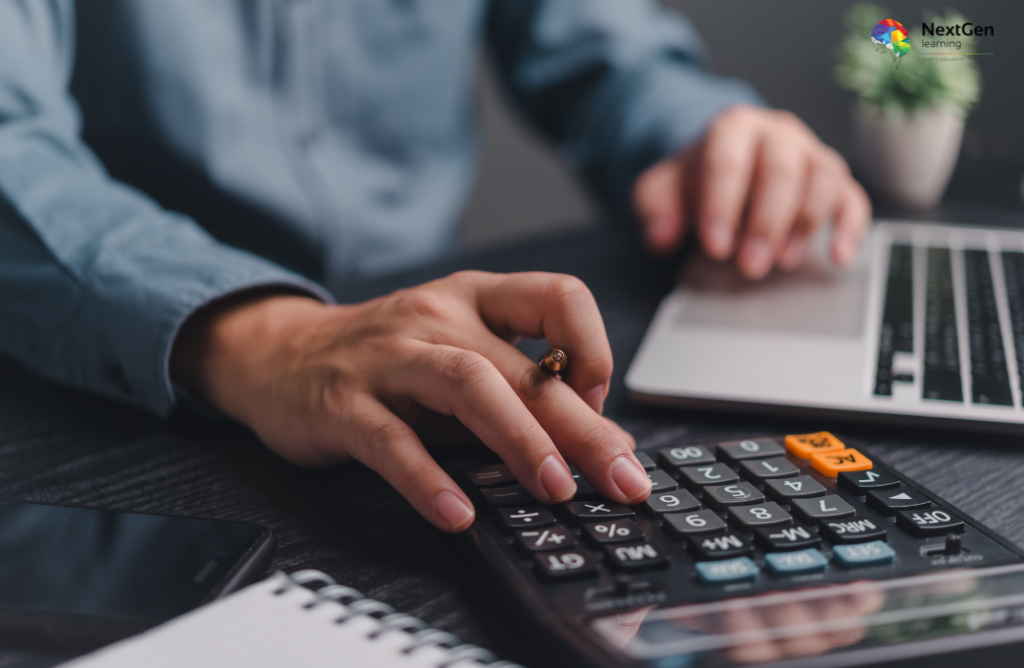 Person Using Calculator and Laptop