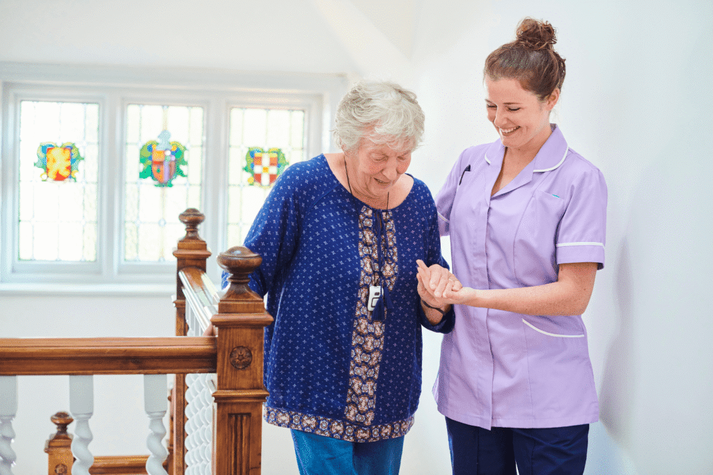 Caregiver assisting an older adult at home, highlighting compassion, supervision, and supportive practices in adult care management