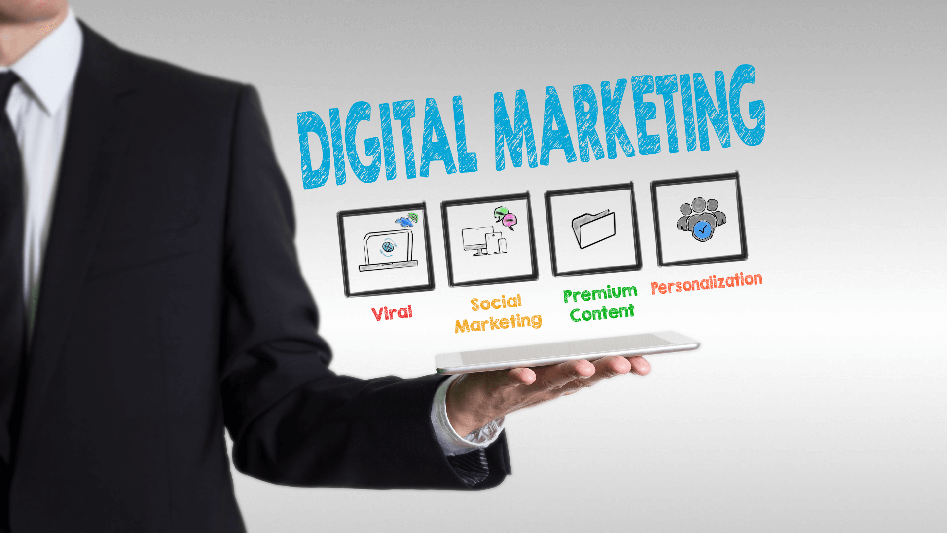 Digital Marketing concepts displayed above a businessman's hand holding a tablet, including Viral, Social Marketing, Premium Content, and Personalisation.